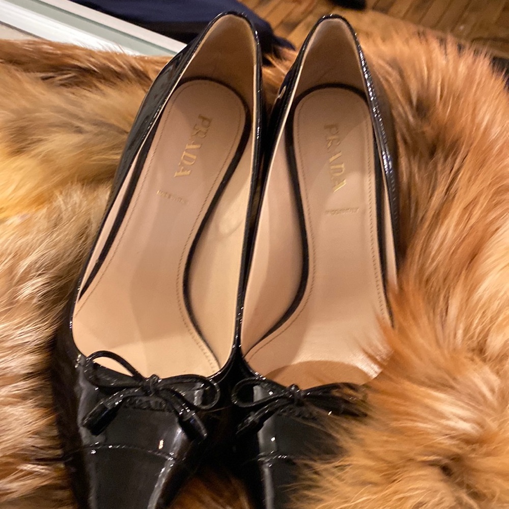 New, never worn Prada patent leather bow toe heels.